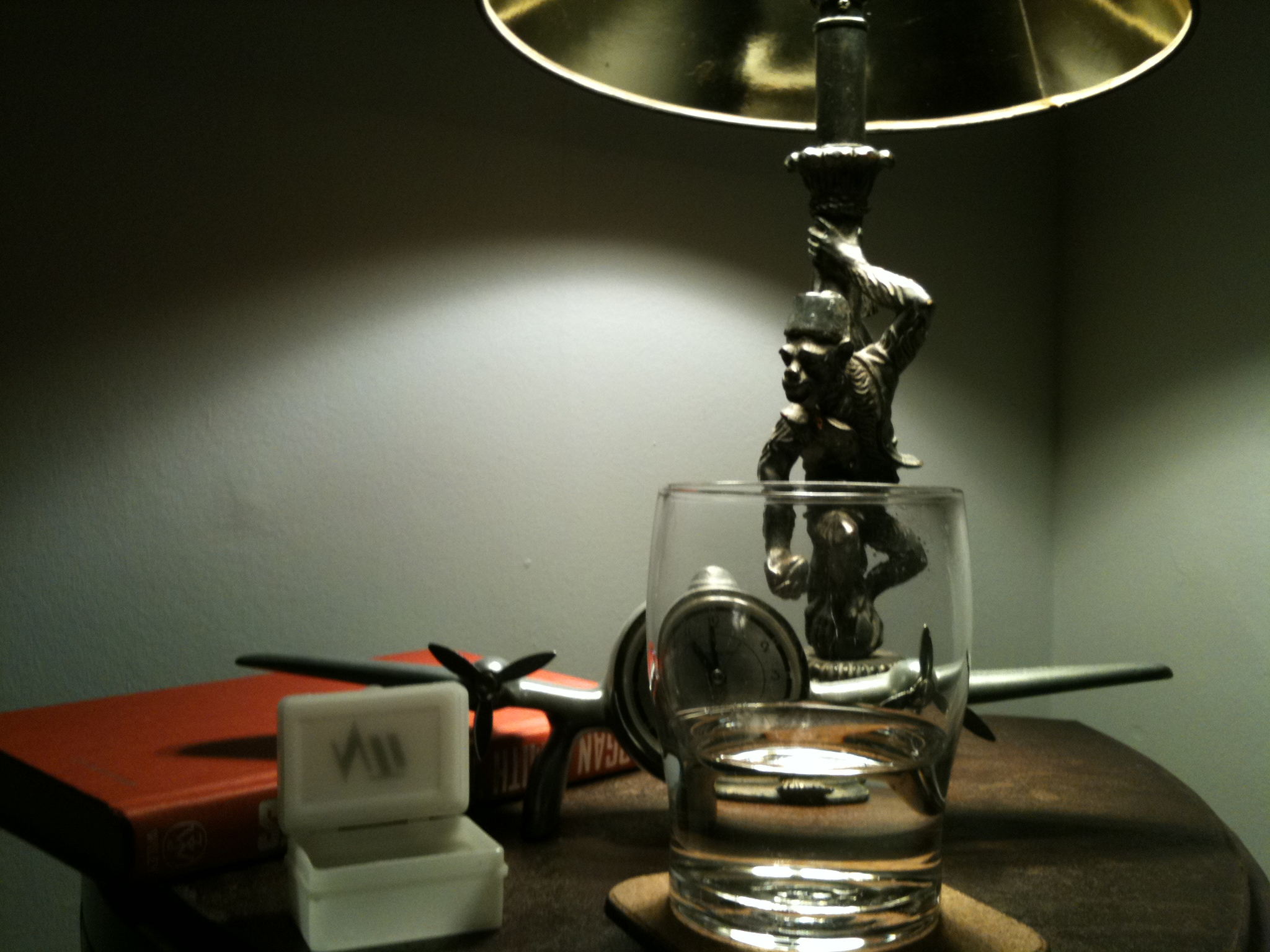 Bedside table with reading lamp, alarm clock, and space for guest essentials.