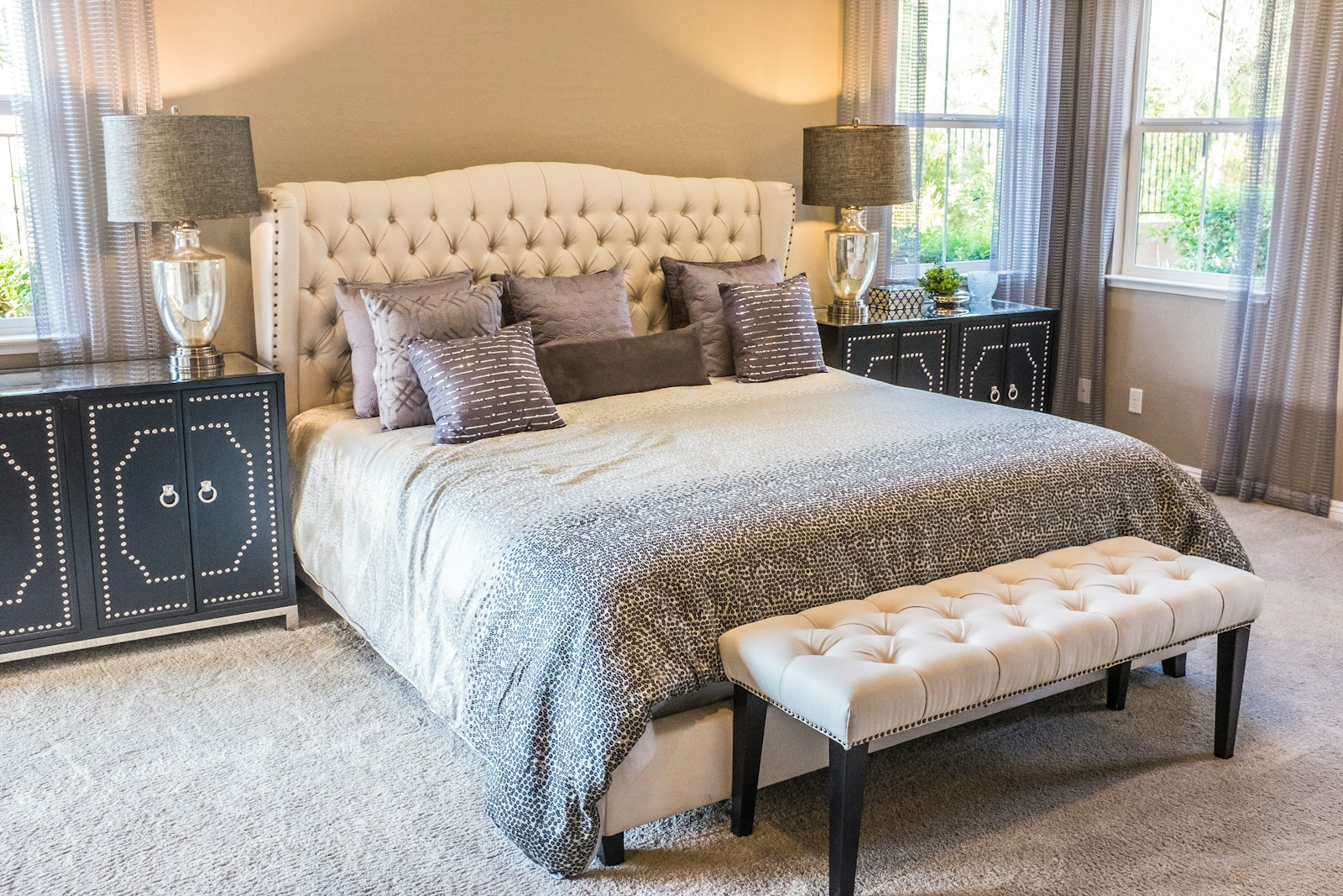 Bright guest room with soft bedding and balcony light
