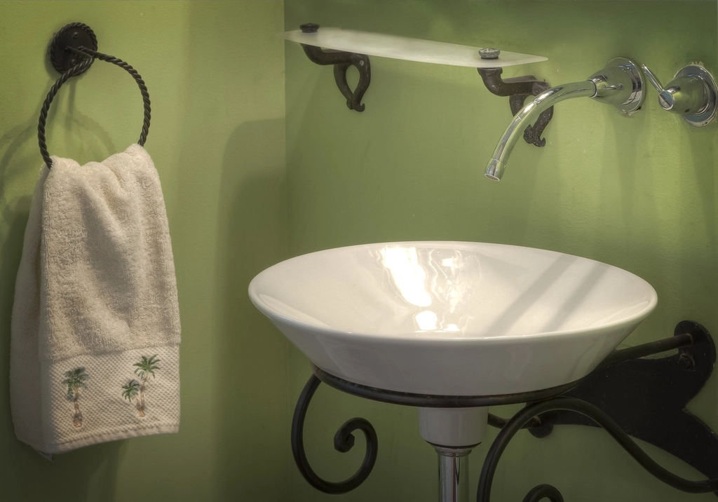Guest bathroom sink with a fresh hand towel ready before a house party.