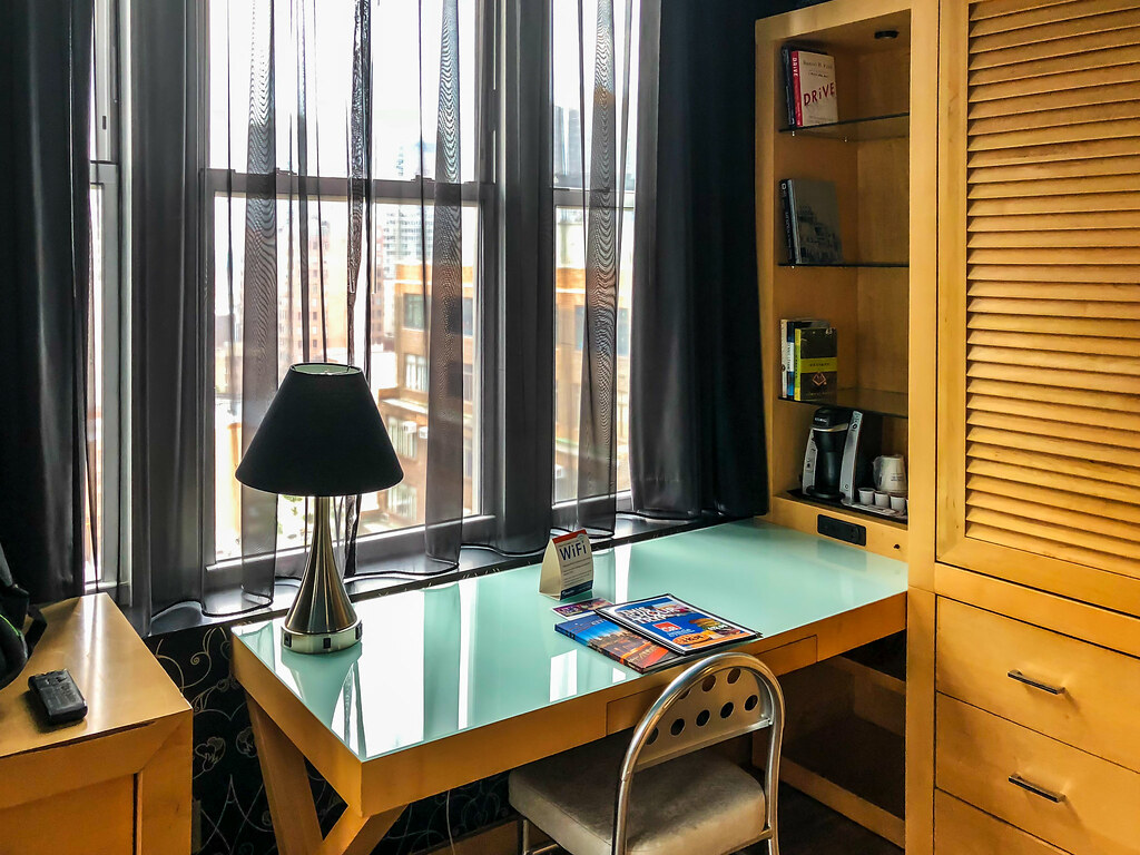Guest-room desk area with natural light and a dedicated work surface